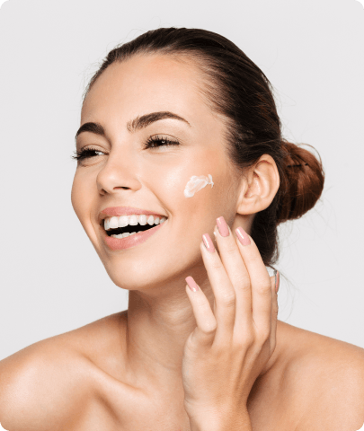 Woman using skincare products