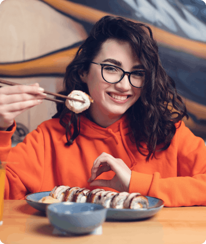 Woman eating sushi