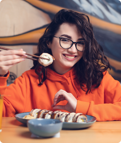 Woman eating sushi