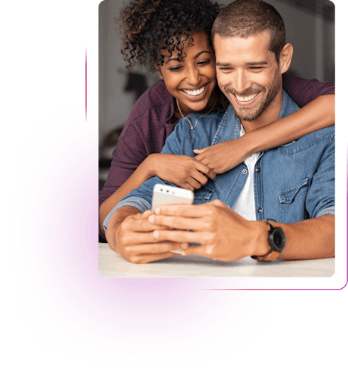 Young couple holding an electronic device