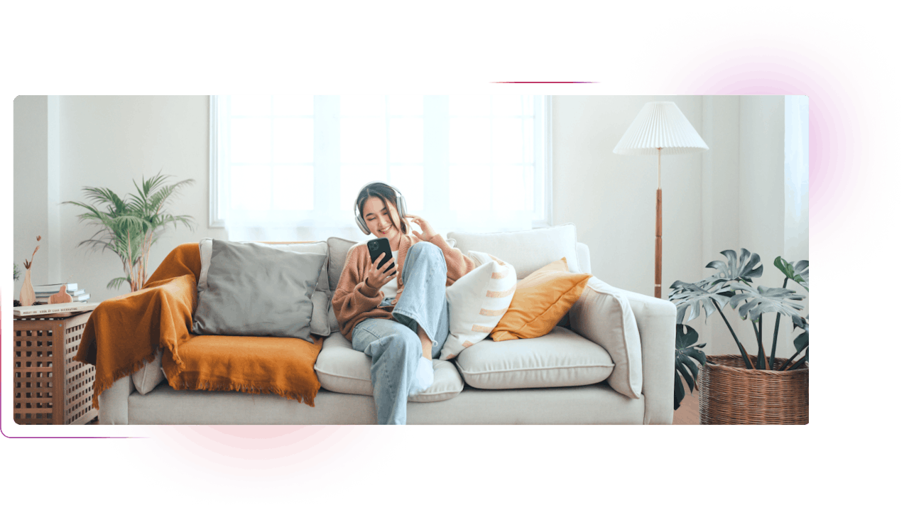 Woman with smartphone sitting on the couch