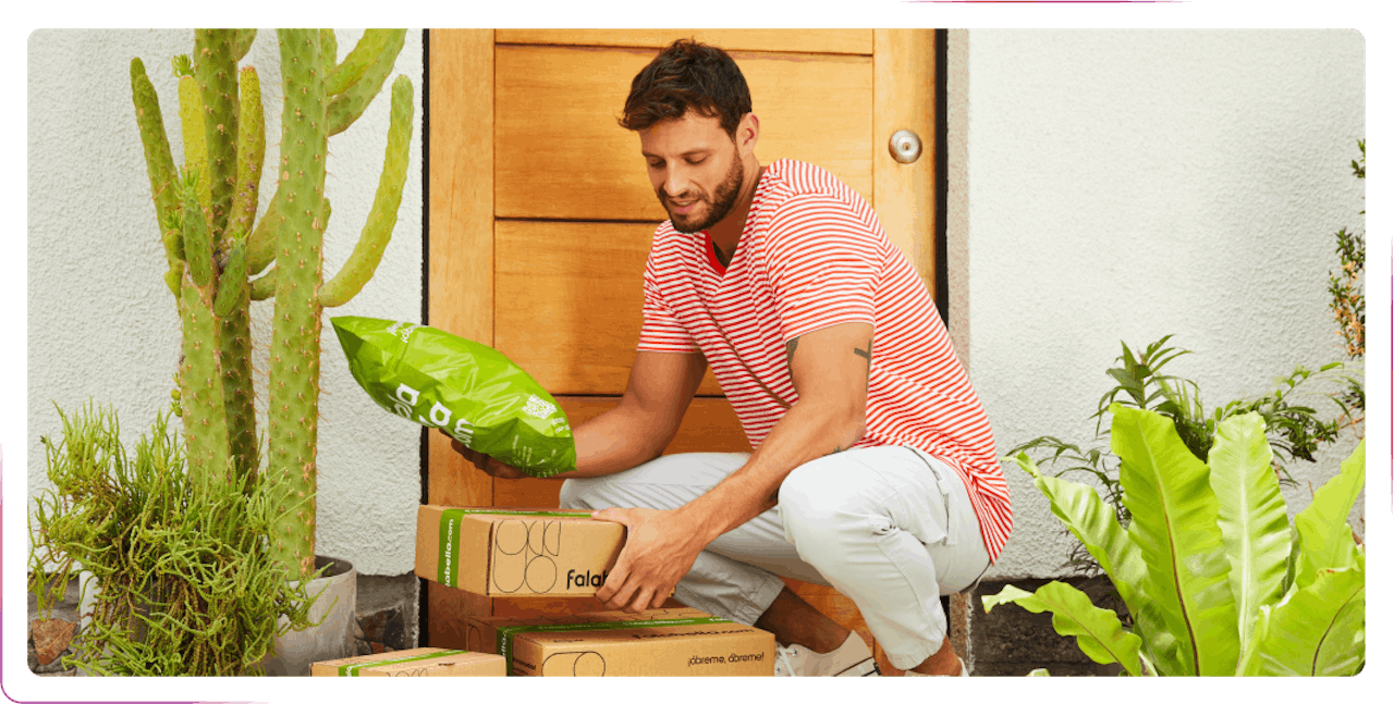 a young man transplanting flowers