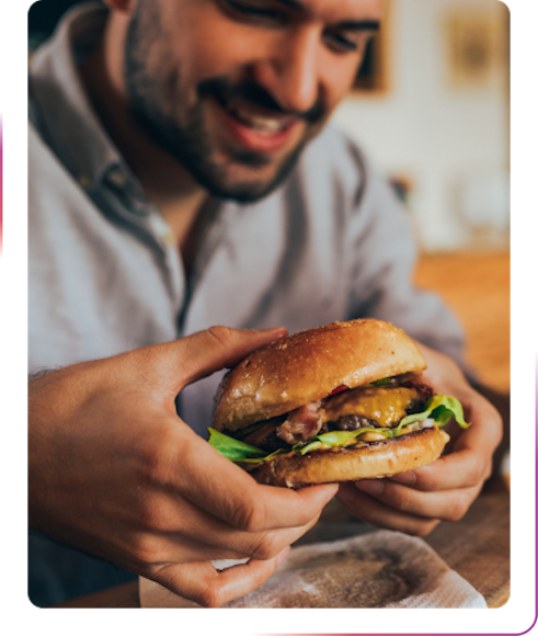 A man holding a burger