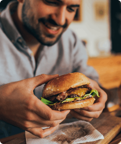 A man holding a burger