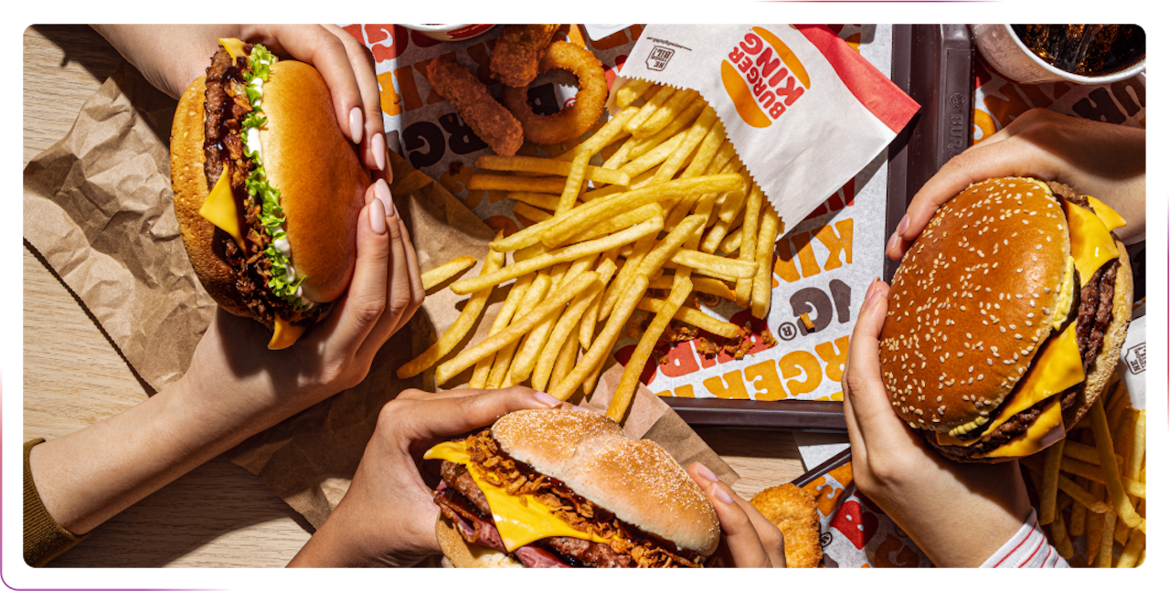 Hands holding foods burgers nad fries