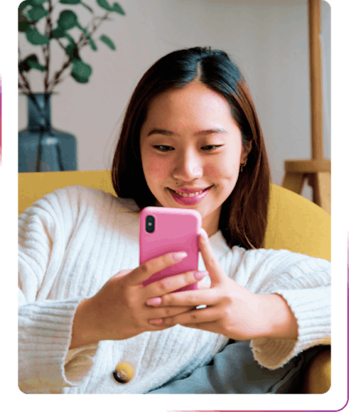 girl smiling using phone