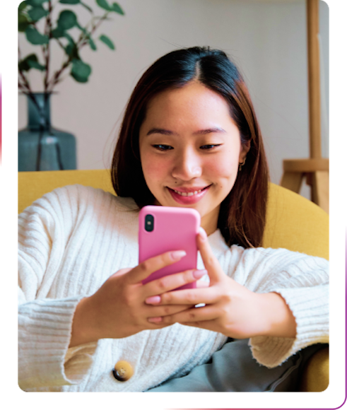 girl smiling using phone