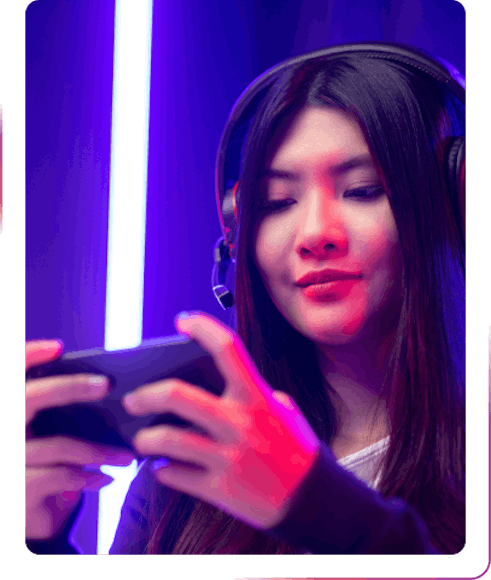 young girl using a phone and headphones
