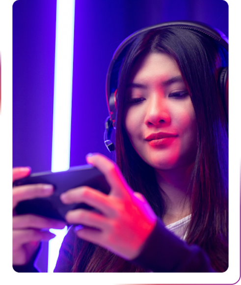 young girl using a phone and headphones