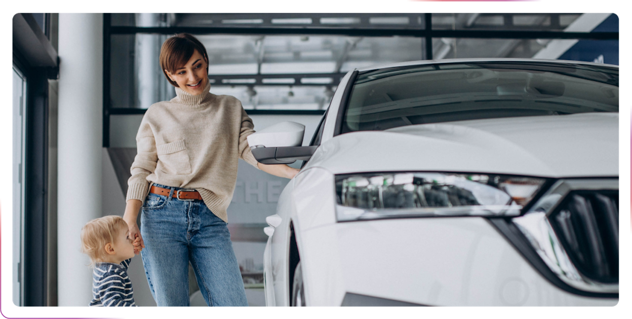 young woman standing next to white car with a child
