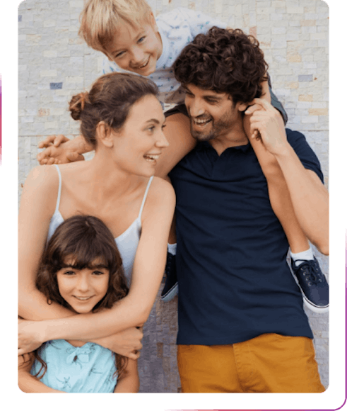 Family holding children and smiling
