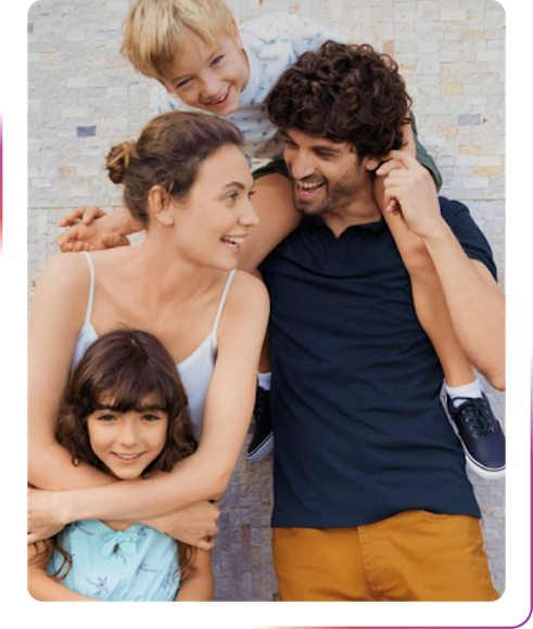 Family holding children and smiling