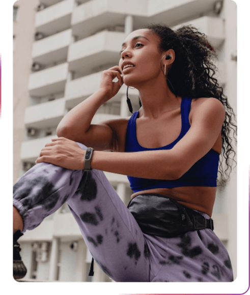 young woman wearing sports clothes using headphones