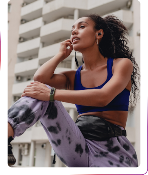 young woman wearing sports clothes using headphones