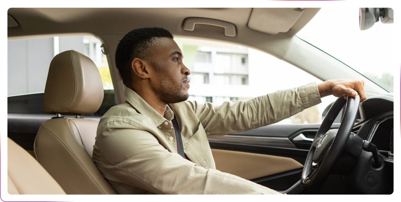 young man driving a car