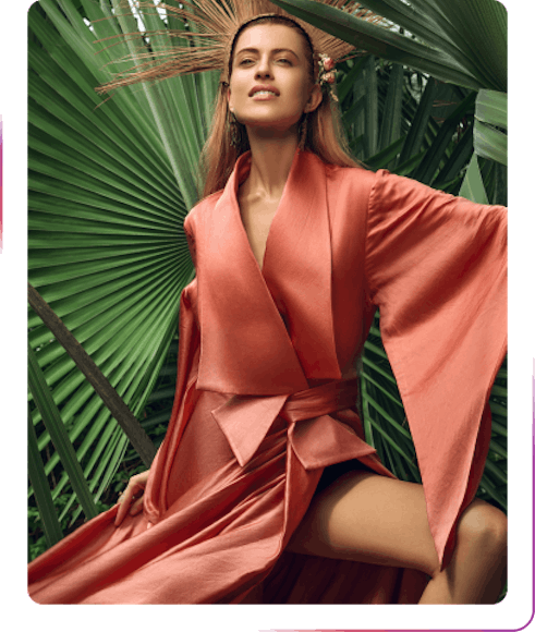 young woman posing next to the palm