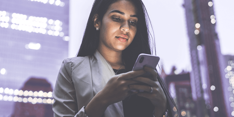 Woman reading with smartphone