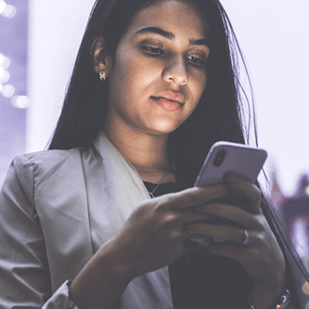Woman reading with smartphone