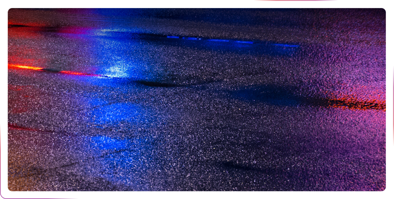 lights reflecting in a puddle