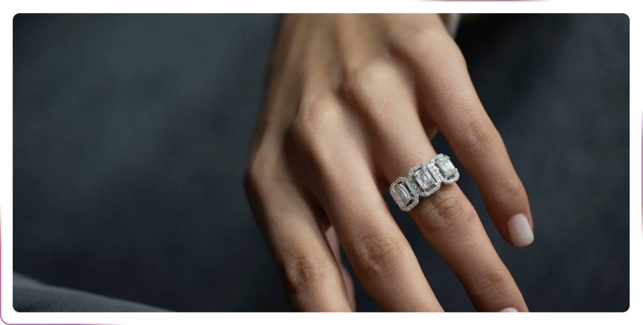 a hand wearing silver ring