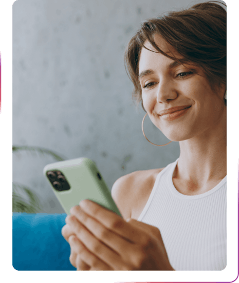 young girl using mobile phone and smiling