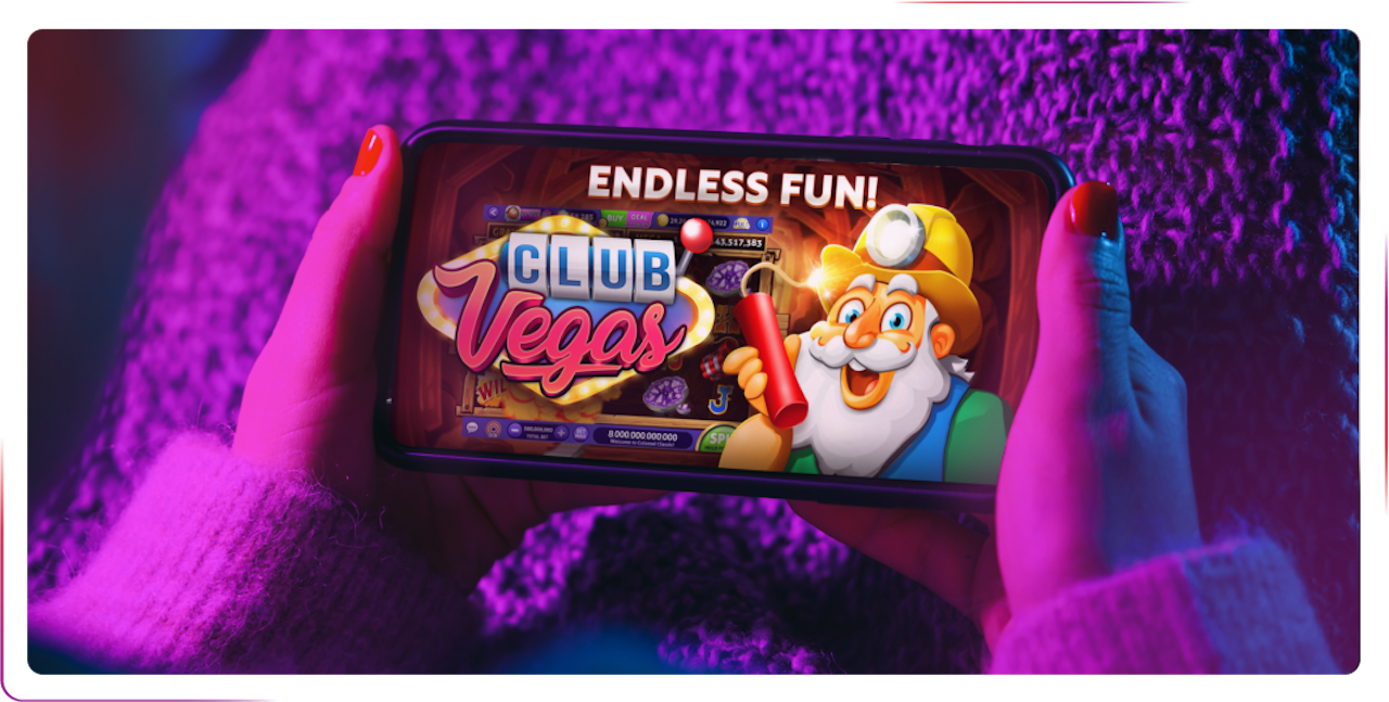 view of hands playing game on mobile phone