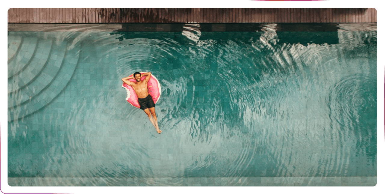 A man chilling at the swimming pool