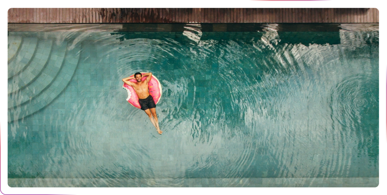A man chilling at the swimming pool