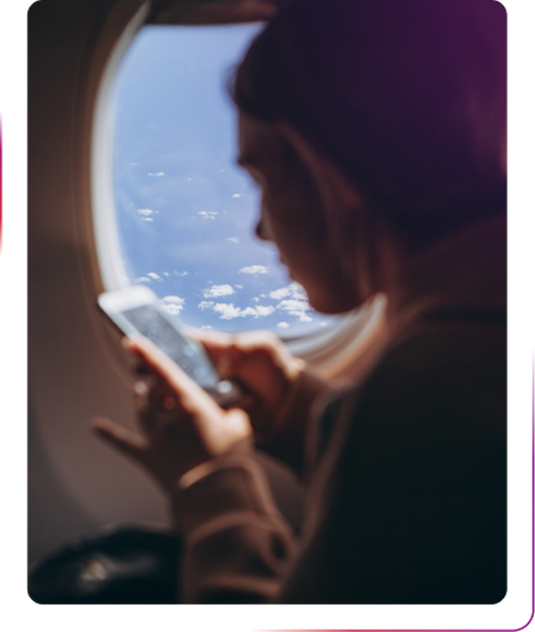 A girl using phone during the flight