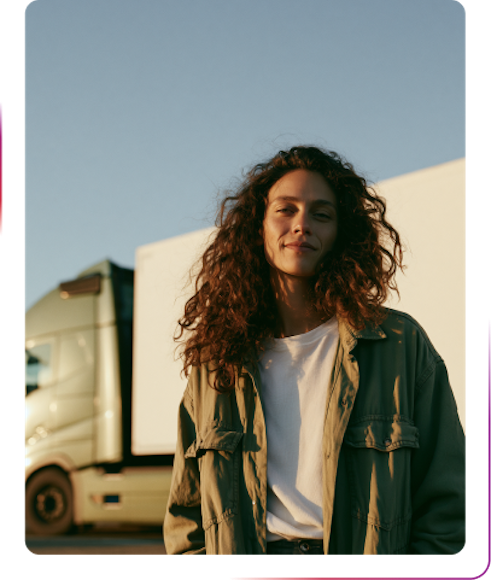 a girl standing next to truck