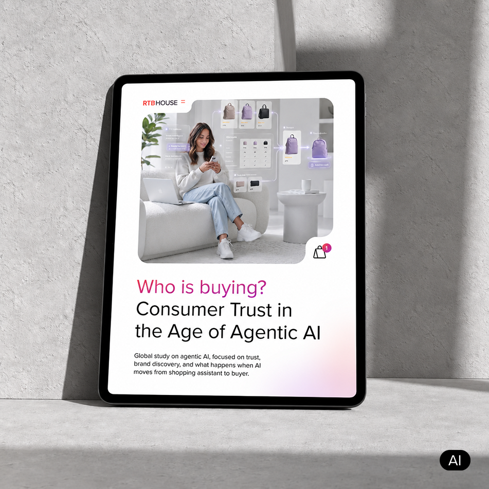 Tablet displaying RTB House's report cover on consumer trust and agentic AI's impact on holiday shopping.