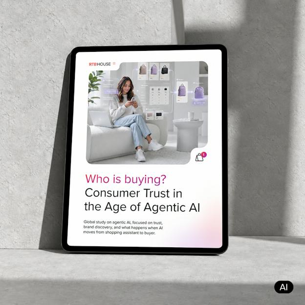 Tablet displaying RTB House's report cover on consumer trust and agentic AI's impact on holiday shopping.