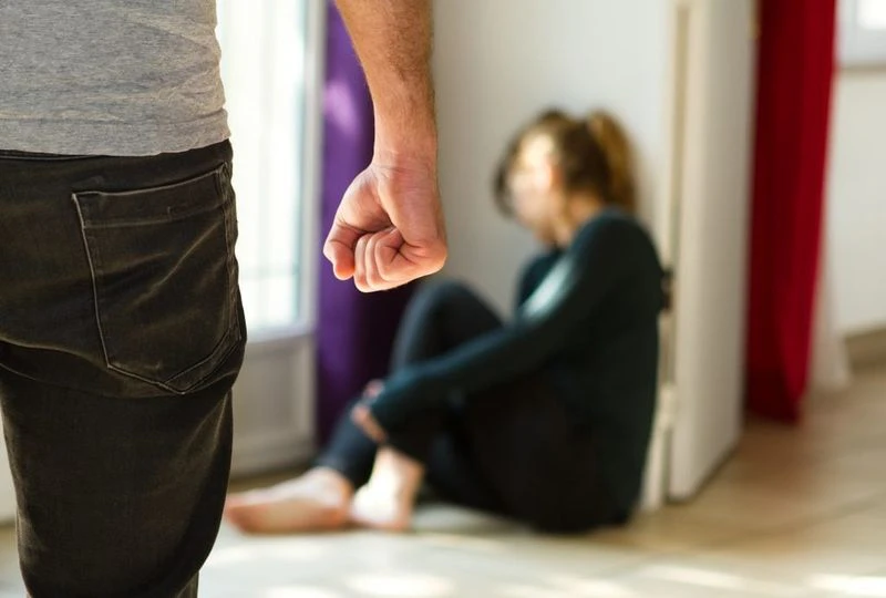 Man threatening a woman.