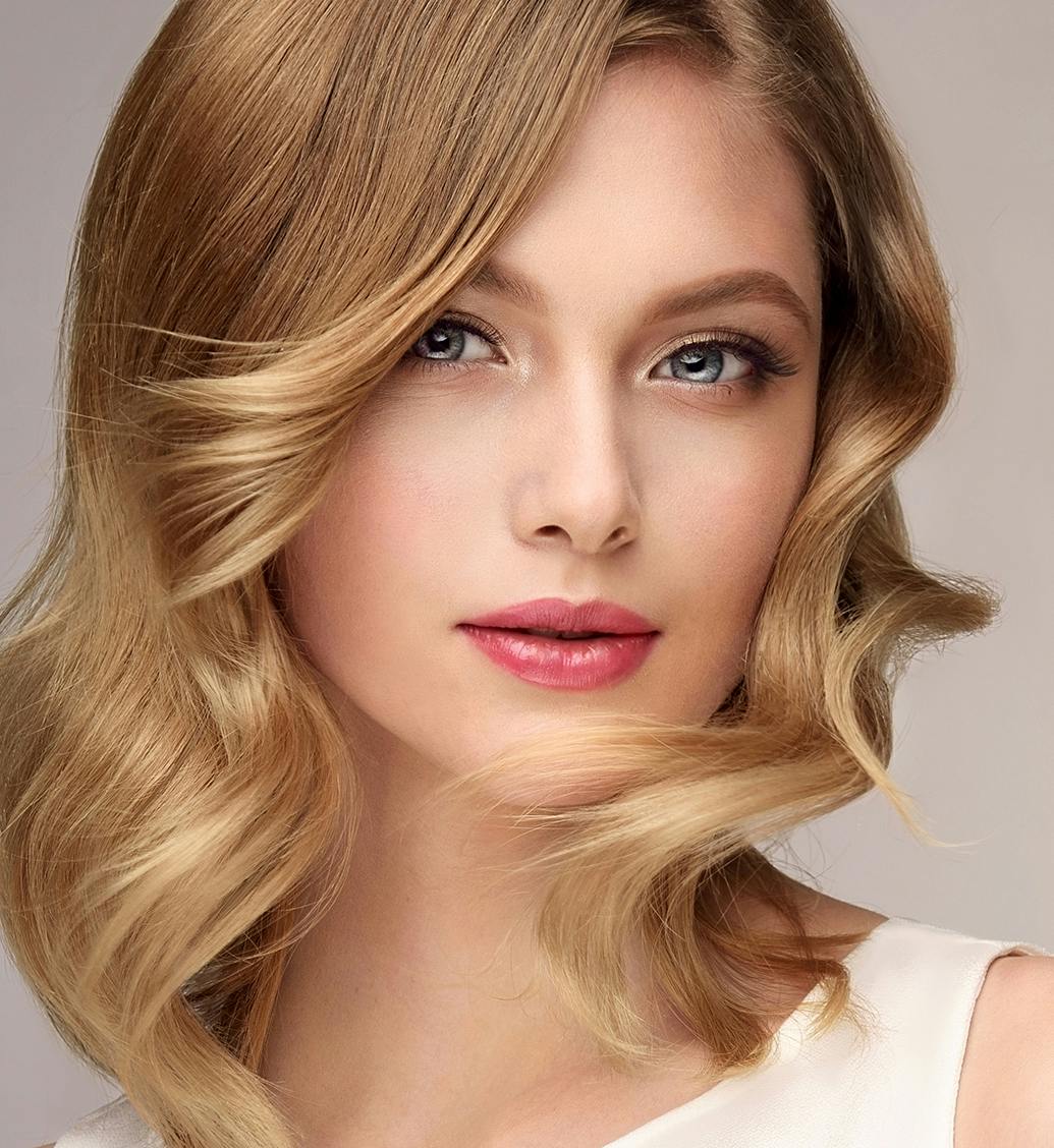 woman with blonde hair and pink lips