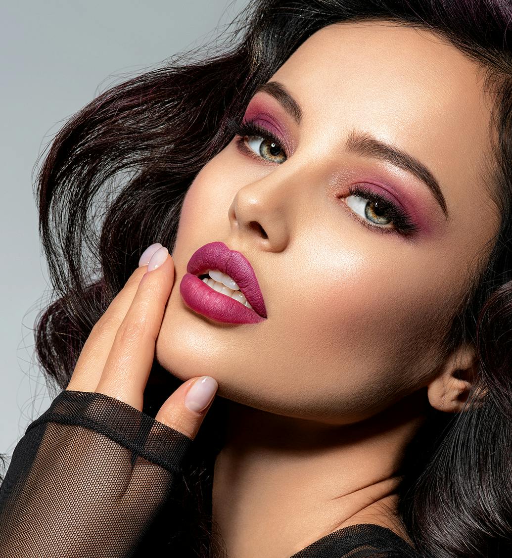 woman with pink lips and pink eyeshadow