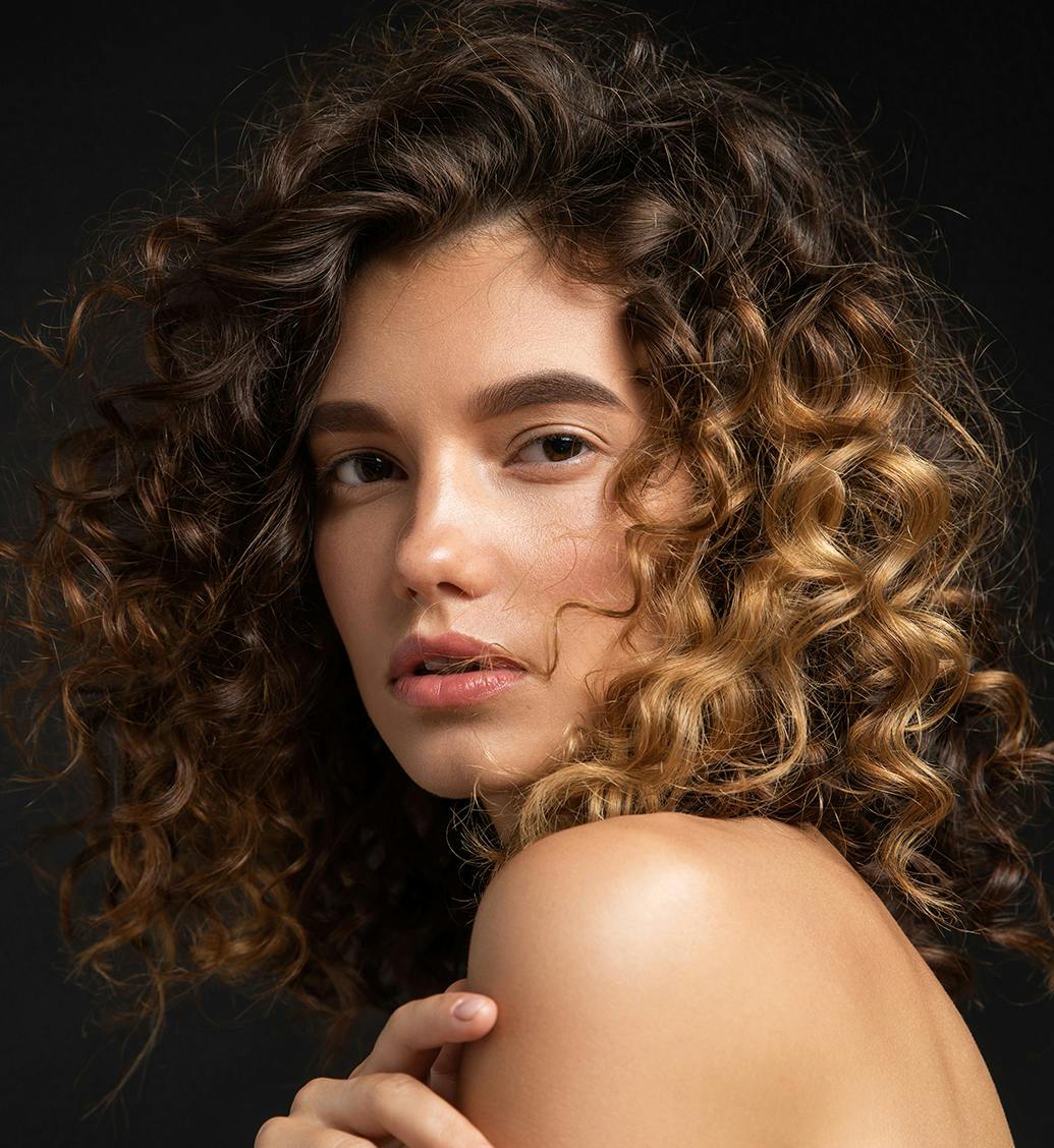 woman with brown curly hair