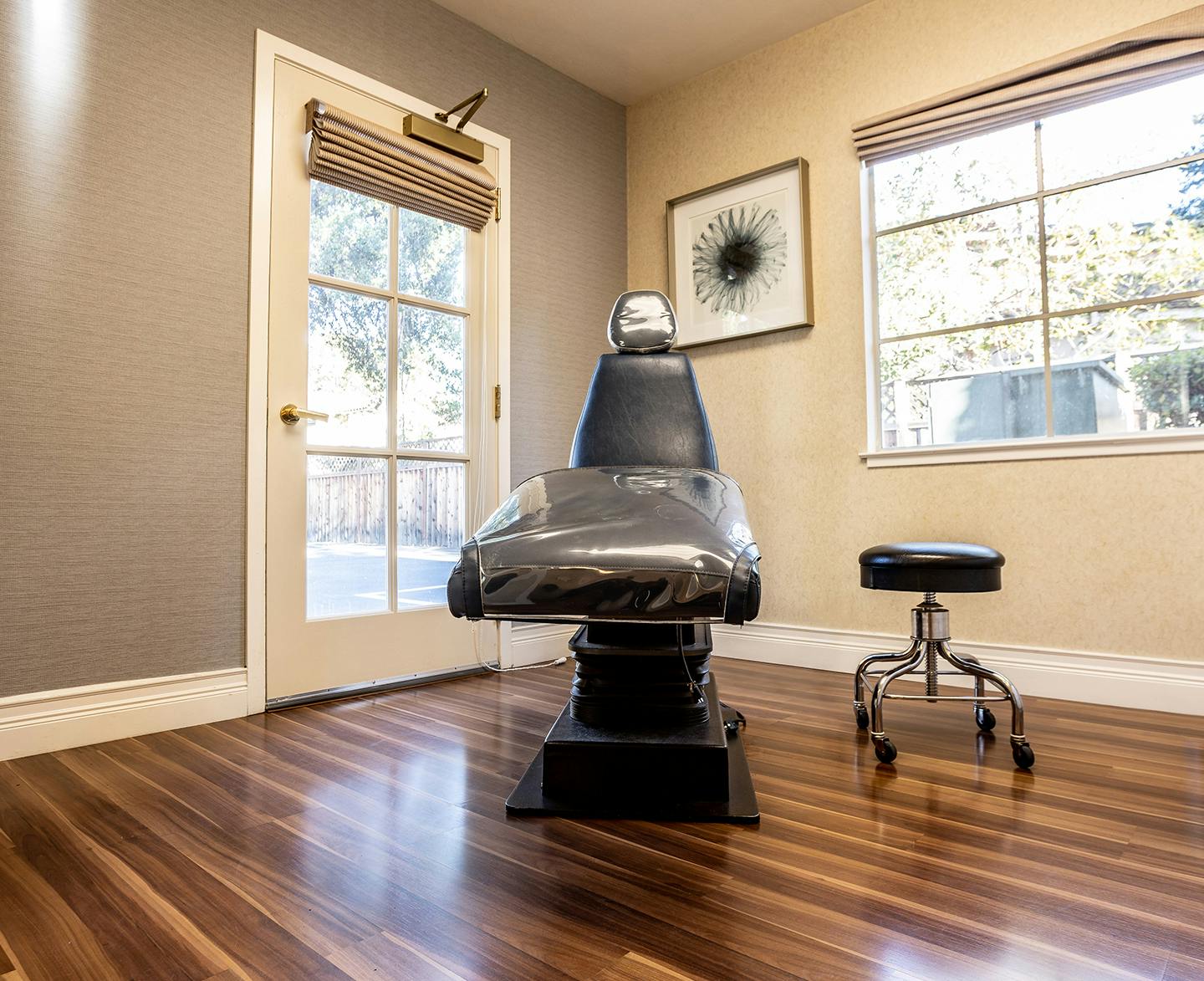 Patient chair with a stool beside it