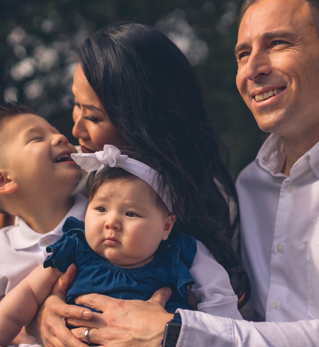 Medium shot of Dr. Graw in red pantsm white shirt, and gray jacket.