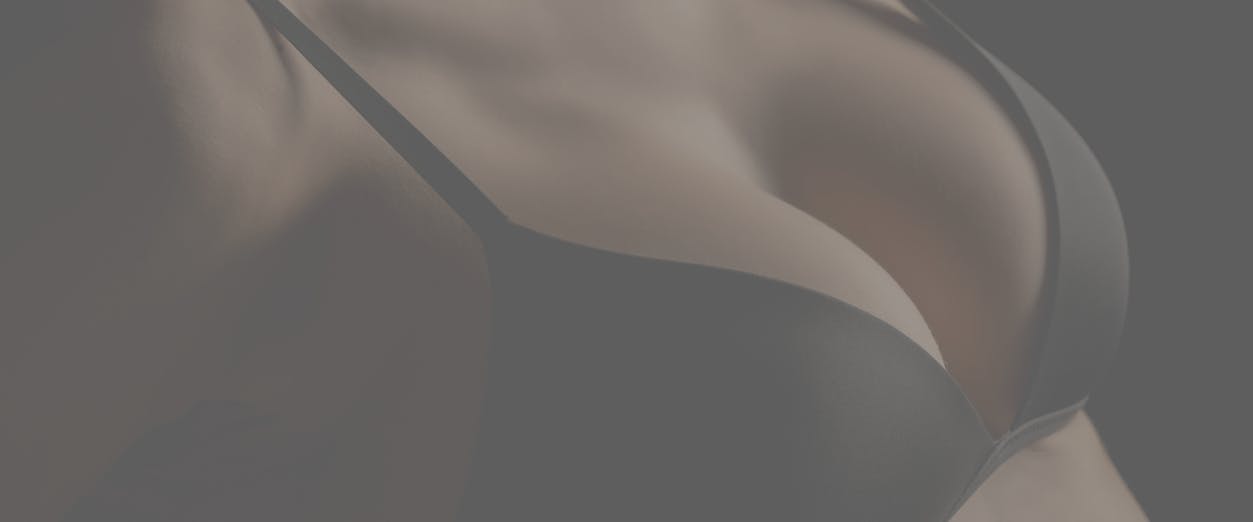 Woman in bra showing off cleveage