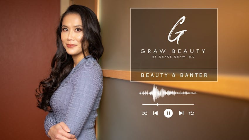 Dr. Graw with arms crossed leaning on a wall