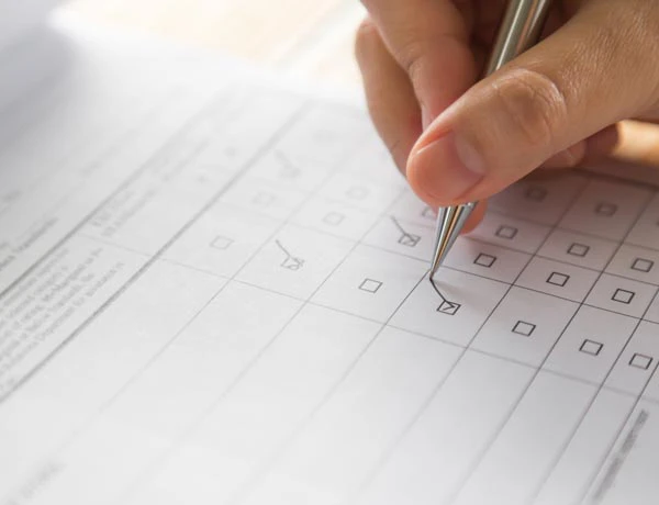 Peninsula Group Limited - An employer working through a safety checklist