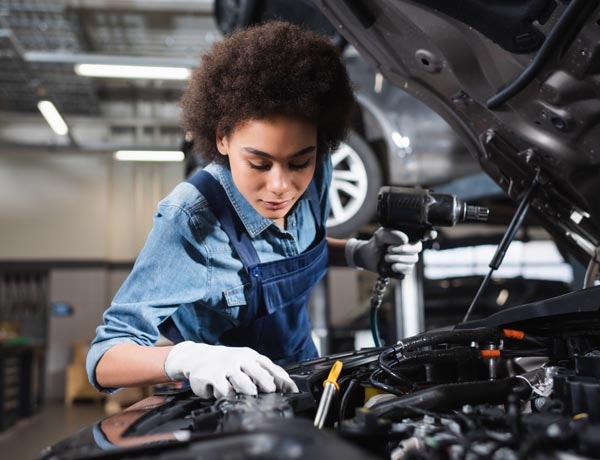 Peninsula Group Limited - A mechanic fixing an engine