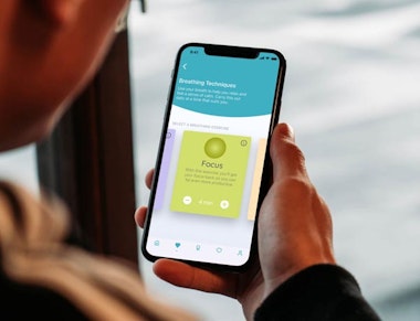 Peninsula Group Limited - An employee using their phone to access wellbeing software