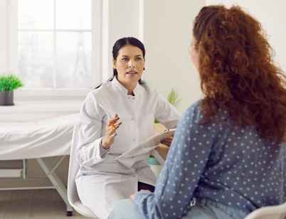 Peninsula Group Limited - A healthcare worker discussing an issue with a patient