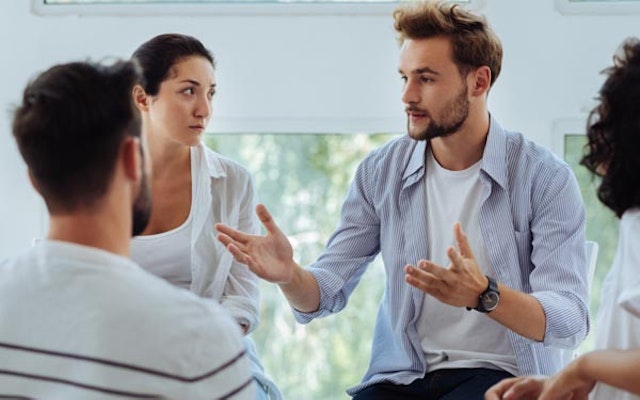 Peninsula Group Limited - Someone conducting mental health first aid training to a group of managers