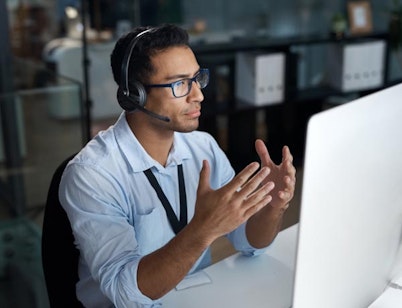 Peninsula Group Limited - An employer wearing a headset while on a video call