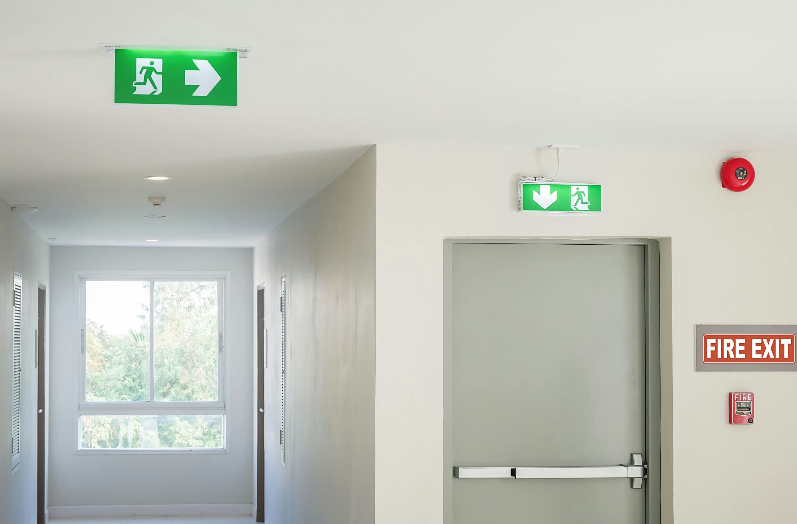 Window and door with fire exit sign above