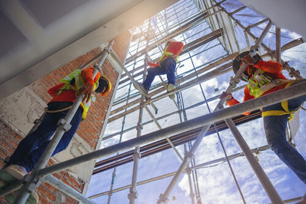 Peninsula Group Limited - Three construction workers climbing on scaffolding