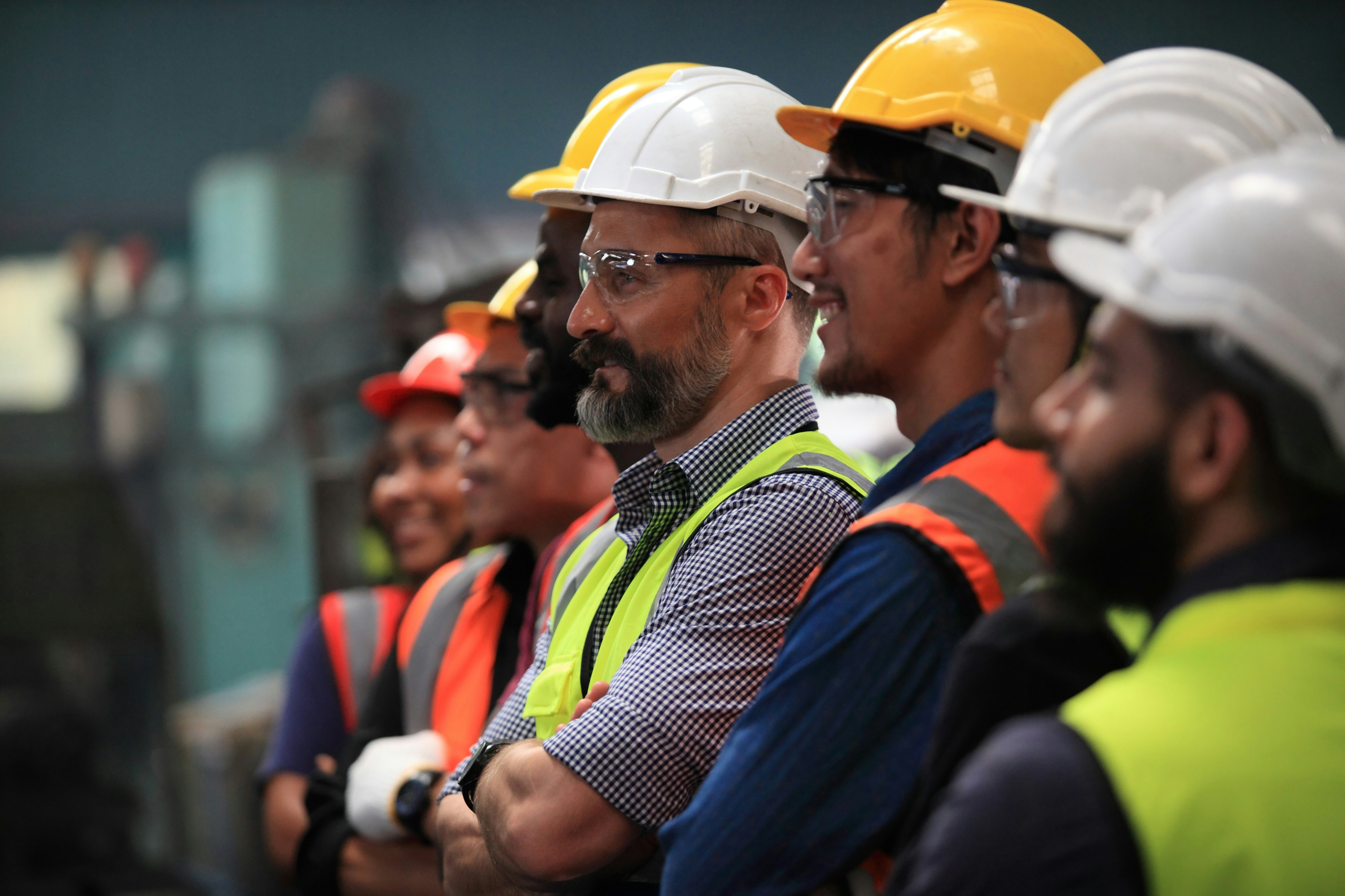 Peninsula Group Limited - a group of workers in hardhats and full PPE