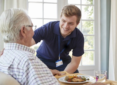 Carer and caree laughing together